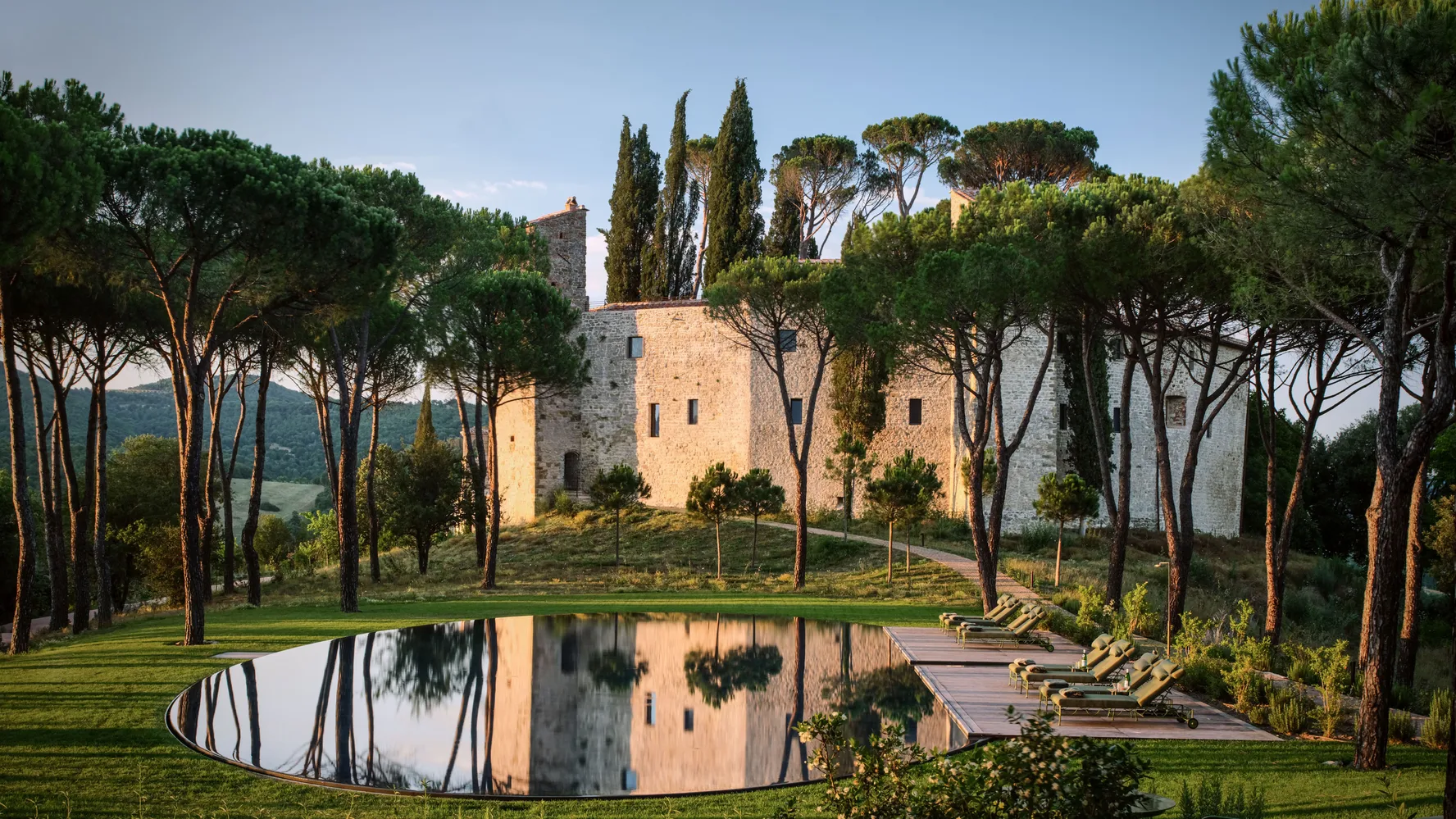 The thousand-year-old castle and reflecting pool at Castello di Reschio