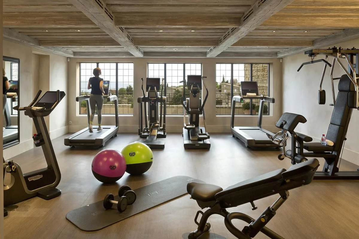Fitness room with exercise equipment and valley views through windows