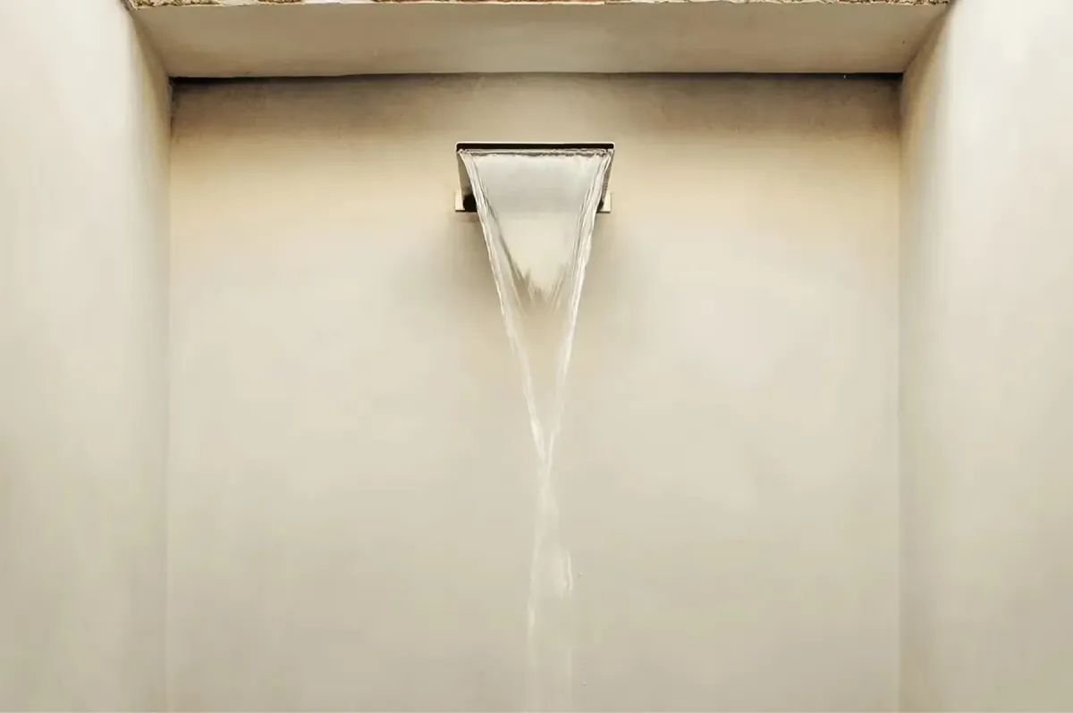 Minimalist interior view of architectural window frame casting clean shadow on plaster wall
