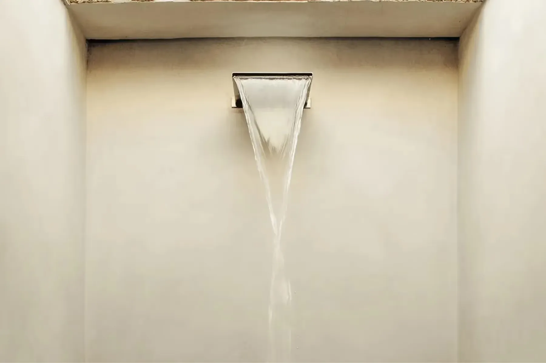 Minimalist interior view of architectural window frame casting clean shadow on plaster wall