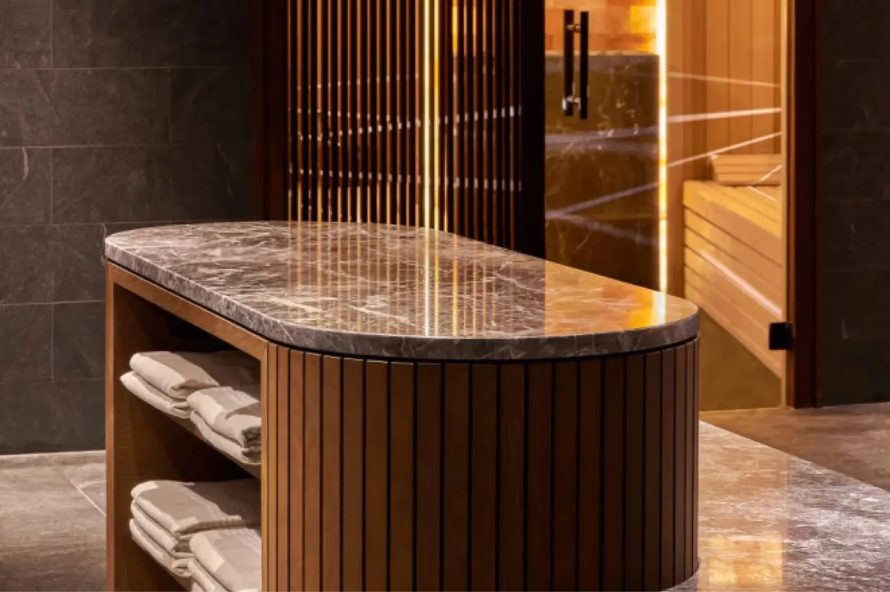 Spa treatment area with marble countertop, wood paneling, and ambient lighting