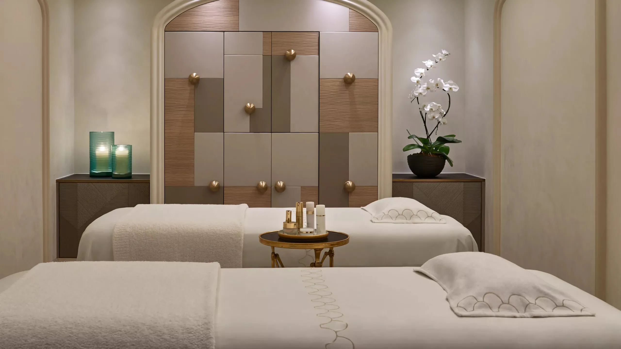Spa pool area with blue tiles, white loungers, and architectural detailing