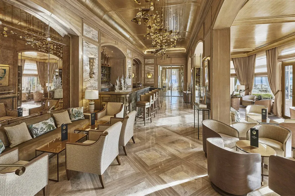 Grand salon with coffered ceiling and multiple seating arrangements