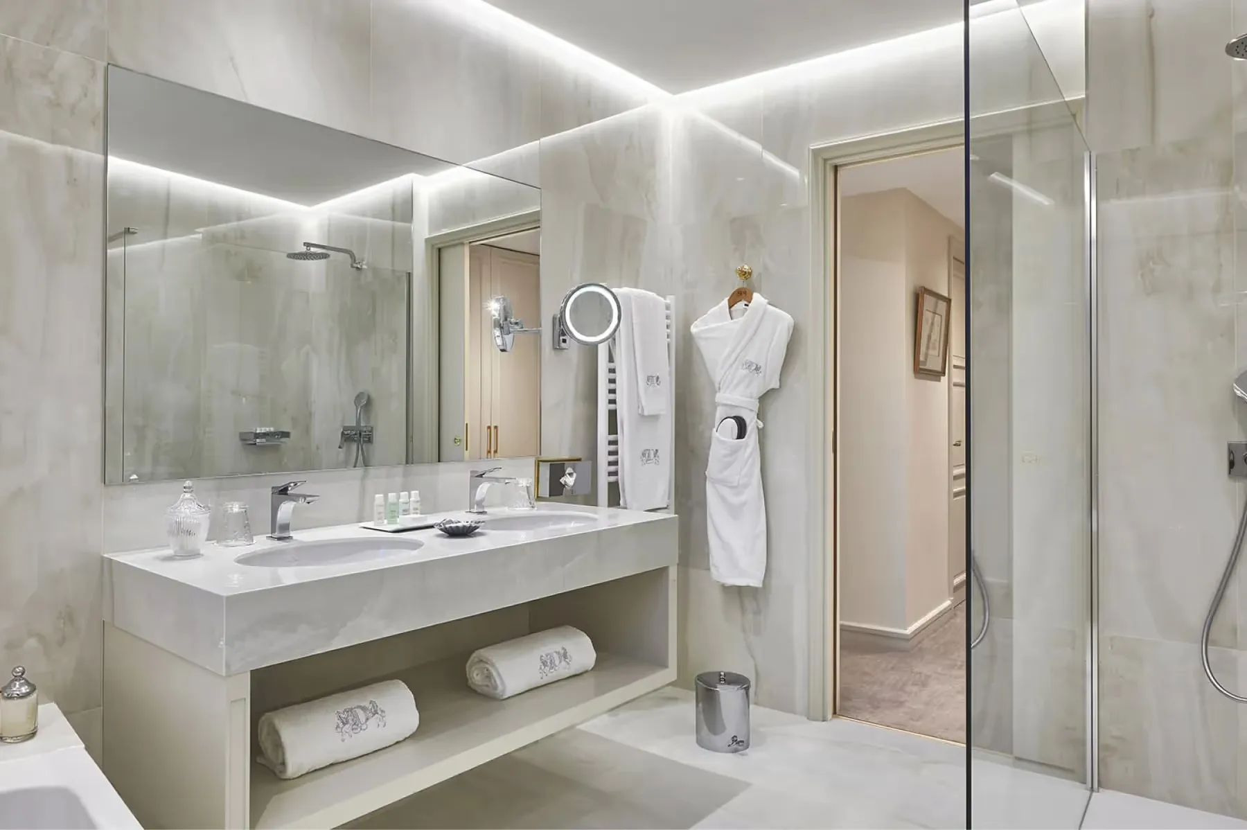 Bathroom with floating vanity, large mirror, and modern fixtures