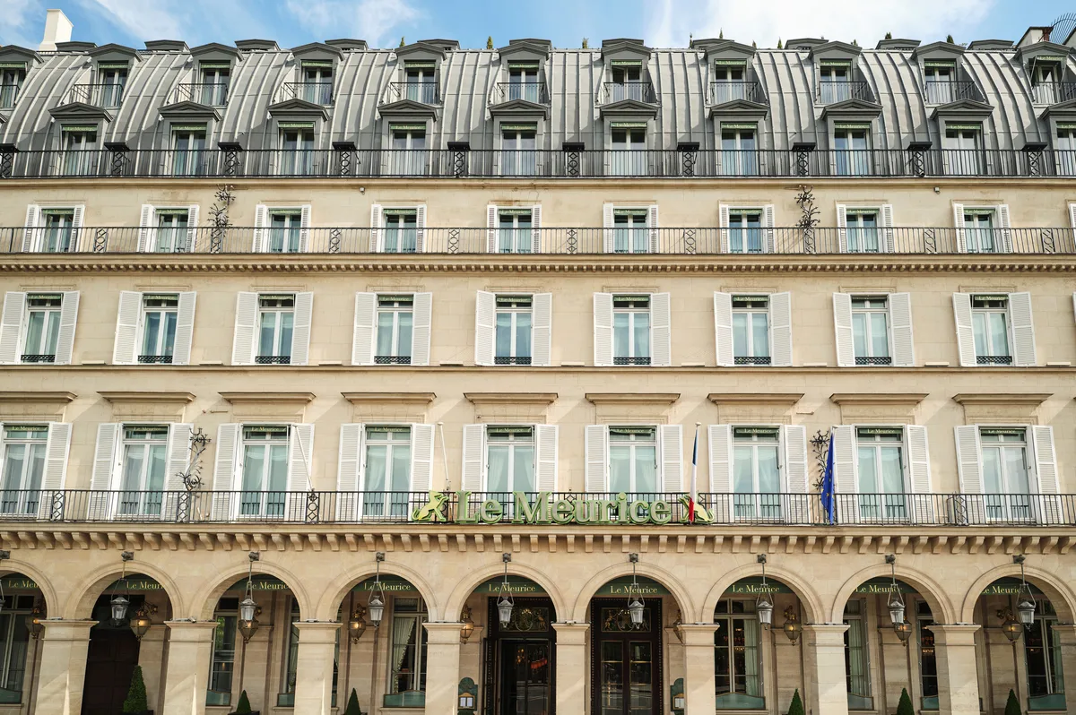 The historic Beaux-Arts facade of the hotel, a cream-colored palazzo with mansard roof