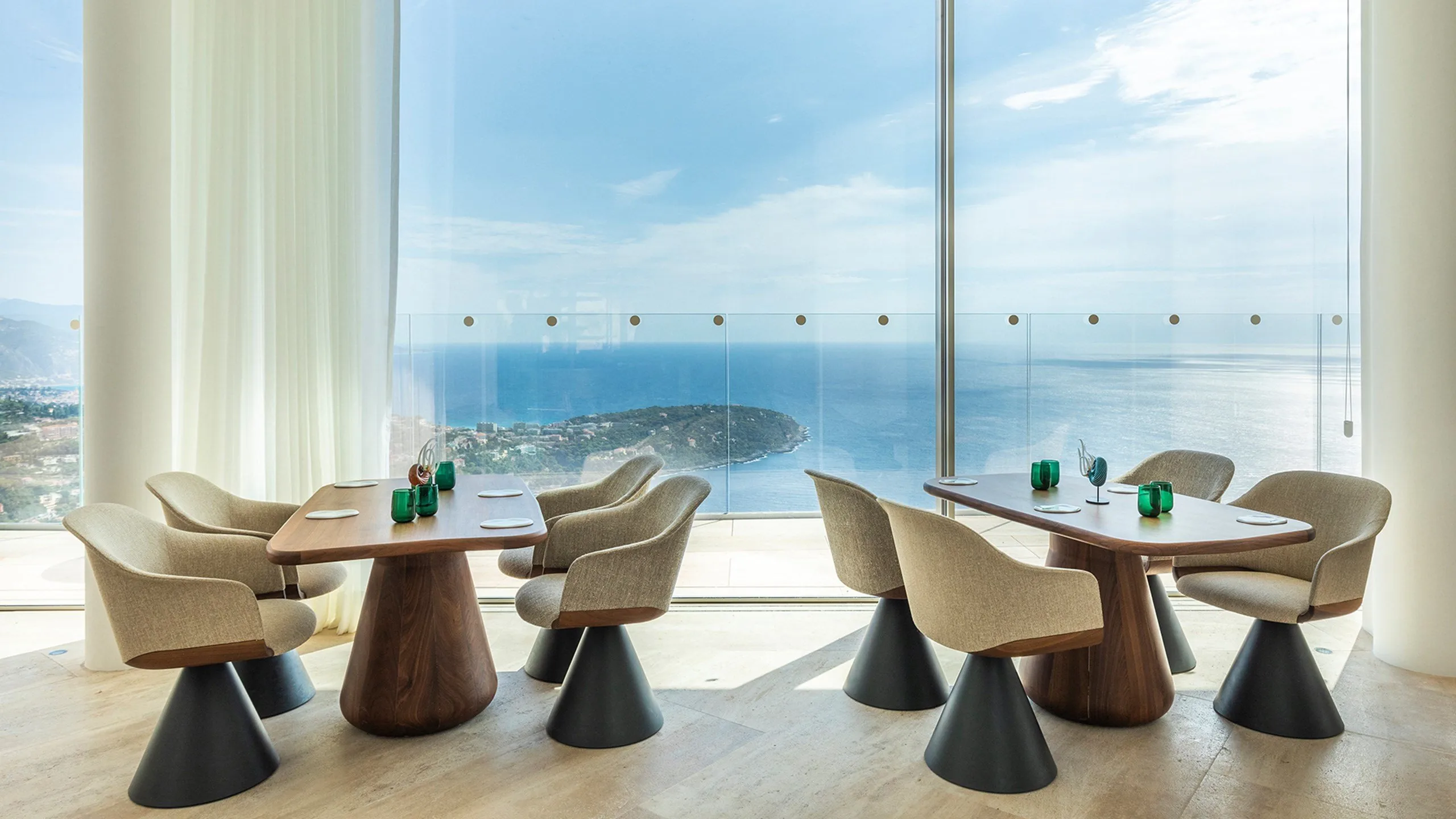 Dining lounge with blue chairs and sea view